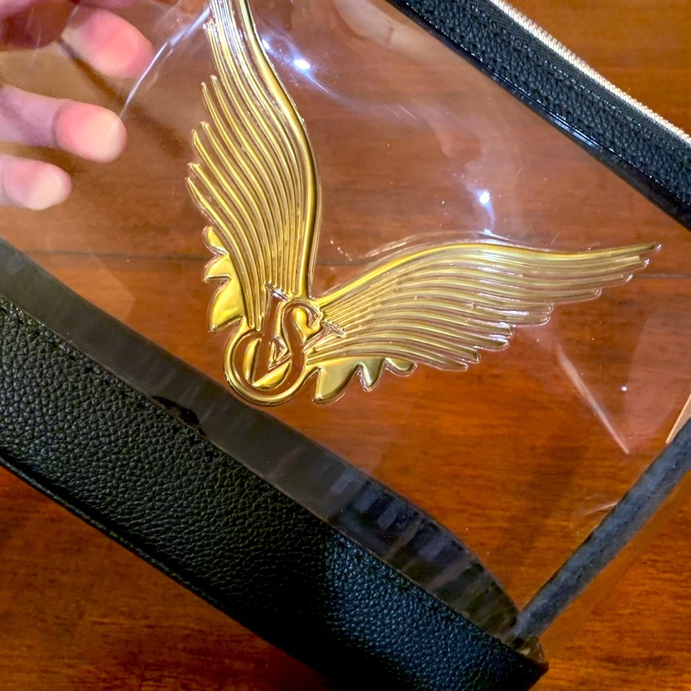 Clear and Black with Gold Winged Logo pouch/cosmetic case,great for travel,must!